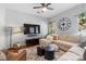 Spacious living room with a plush sectional sofa and large screen TV at 7341 Adare Mews Rd, Charlotte, NC 28217