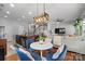 Open-concept floor plan with a dining area connected to a comfortable living space at 7341 Adare Mews Rd, Charlotte, NC 28217