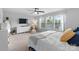 Bright main bedroom with large windows, dresser, TV and ceiling fan at 7341 Adare Mews Rd, Charlotte, NC 28217