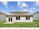 Backyard featuring a well-manicured lawn, a concrete patio, and a well-maintained exterior at 9948 Manor Vista Trl, Kannapolis, NC 28027