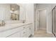 Bathroom featuring double sink vanity, white cabinetry and a walk-in glass shower at 9948 Manor Vista Trl, Kannapolis, NC 28027