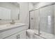 Modern bathroom features a glass-enclosed shower, sleek fixtures, and contemporary design at 9948 Manor Vista Trl, Kannapolis, NC 28027