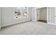Sunlit bedroom boasts plush carpeting, neutral walls, and a window with neighborhood views at 9948 Manor Vista Trl, Kannapolis, NC 28027