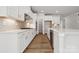 Elegant kitchen featuring white cabinetry, stainless steel appliances, and a modern gas cooktop at 9948 Manor Vista Trl, Kannapolis, NC 28027