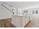 Bright kitchen features a large island with a farmhouse sink and stainless steel appliances at 9948 Manor Vista Trl, Kannapolis, NC 28027