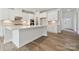 Well-equipped kitchen features an island, stainless steel appliances, and open layout at 9948 Manor Vista Trl, Kannapolis, NC 28027