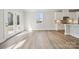 Bright living area open to kitchen that features white cabinets and stainless steel appliances at 9948 Manor Vista Trl, Kannapolis, NC 28027