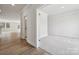 Bright, open-concept living space with hardwood floors, neutral walls, and access to other rooms at 9948 Manor Vista Trl, Kannapolis, NC 28027