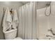 Clean bathroom with a tub and shower combination, a decorative black and white shower curtain, and fresh towels at 1020 Forbishire Dr, Matthews, NC 28104