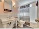 Classic bathroom with pedestal sink, neutral walls, and walk-in shower at 1020 Forbishire Dr, Matthews, NC 28104