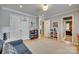 Neutral-toned bedroom with hardwood floors, two closets, and access to the other rooms in the home at 1020 Forbishire Dr, Matthews, NC 28104