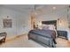 Serene bedroom with dark wood furniture, neutral walls, and comfortable carpet at 1020 Forbishire Dr, Matthews, NC 28104