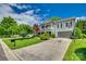Beautiful two-story home with a welcoming front porch, manicured lawn, and a two-car garage, perfect for Gathering living at 1020 Forbishire Dr, Matthews, NC 28104