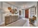 Inviting foyer with a decorative console table, rug, mirror and front door at 1020 Forbishire Dr, Matthews, NC 28104