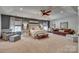 Expansive main bedroom with tray ceiling, sitting area, and large windows offering plenty of natural light at 1020 Forbishire Dr, Matthews, NC 28104