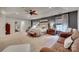 Spacious main bedroom featuring a large bed, seating area, and ample natural light from the many windows at 1020 Forbishire Dr, Matthews, NC 28104