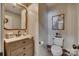 Charming powder room with wood paneling, a decorative mirror, and classic fixtures at 1020 Forbishire Dr, Matthews, NC 28104
