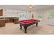 Finished basement with a pool table, wet bar, and exterior door for easy access at 104 Whiterock Dr, Mount Holly, NC 28120