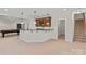 Finished basement with a wet bar, adjacent pool table and staircase access at 104 Whiterock Dr, Mount Holly, NC 28120