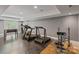 Finished basement space featuring exercise equipment, foosball table, and neutral gray walls at 104 Whiterock Dr, Mount Holly, NC 28120