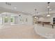 Expansive finished basement features natural light, a wet bar, and space for recreation at 104 Whiterock Dr, Mount Holly, NC 28120