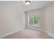 Neutral bedroom featuring one window for natural light and plush carpet at 104 Whiterock Dr, Mount Holly, NC 28120