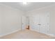 Neutral bedroom with carpet, crown molding, and double closet doors for ample storage space at 104 Whiterock Dr, Mount Holly, NC 28120