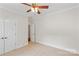 Neutral bedroom features carpet, crown molding, ceiling fan, and closet for ample storage space at 104 Whiterock Dr, Mount Holly, NC 28120