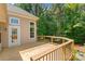 Spacious wooden deck overlooking a lush backyard, ideal for outdoor entertaining or relaxation at 104 Whiterock Dr, Mount Holly, NC 28120