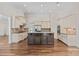 Well-designed kitchen features a dark center island and stainless steel appliances at 104 Whiterock Dr, Mount Holly, NC 28120