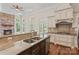 Modern kitchen with island, granite countertops, stainless steel appliances, and access to outdoor living at 104 Whiterock Dr, Mount Holly, NC 28120