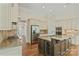 Gourmet kitchen with stainless steel appliances, custom cabinets, and granite countertops at 104 Whiterock Dr, Mount Holly, NC 28120