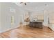 Bright and airy kitchen with white cabinets, a dark island, and hardwood floors at 104 Whiterock Dr, Mount Holly, NC 28120