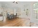Spacious kitchen features a dark wood island, stainless steel appliances, and hardwood flooring at 104 Whiterock Dr, Mount Holly, NC 28120