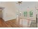 Spacious living room with vaulted ceilings, large windows, and a stone fireplace at 104 Whiterock Dr, Mount Holly, NC 28120