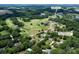 Aerial view showcases the property's location near the clubhouse, golf course and lakes at 105 Chippewa Trail, China Grove, NC at 105 Chippewa Trl, China Grove, NC 28023