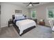 Cozy bedroom with hardwood floors, large windows and comfortable furniture at 105 Chippewa Trl, China Grove, NC 28023