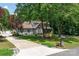Beautiful two-story home with well-manicured lawn, mature trees, and a long driveway at 105 Chippewa Trl, China Grove, NC 28023