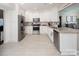 Bright kitchen with white cabinets, stainless steel appliances, and granite countertops at 105 Chippewa Trl, China Grove, NC 28023