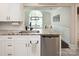 Bright kitchen features granite countertops, stainless steel appliances, and white cabinetry at 105 Chippewa Trl, China Grove, NC 28023