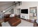 Open-concept living room featuring vaulted ceilings, fireplace, and hardwood flooring at 105 Chippewa Trl, China Grove, NC 28023