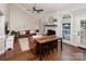 Open-concept living room featuring vaulted ceilings, fireplace, and hardwood flooring at 105 Chippewa Trl, China Grove, NC 28023