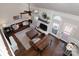 Spacious living room with hardwood floors, fireplace, ceiling fan, and stylish furnishings at 105 Chippewa Trl, China Grove, NC 28023