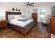 Main bedroom featuring hardwood floors, a ceiling fan, and ample natural light at 105 Chippewa Trl, China Grove, NC 28023