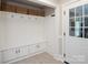 Mudroom offers built-in bench with storage cabinets and beadboard walls at 105 Chippewa Trl, China Grove, NC 28023