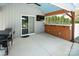 Outdoor patio bar with built-in counters, sliding glass doors, and outdoor TV, perfect for entertaining at 105 Chippewa Trl, China Grove, NC 28023
