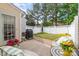 Backyard with a small patio and outdoor seating, featuring a grill and a well-maintained lawn at 10617 Fuller Ridge Cir, Charlotte, NC 28270