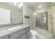 Bathroom featuring tile flooring, granite countertops, and a glass shower with mosaic tiles at 10617 Fuller Ridge Cir, Charlotte, NC 28270
