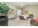 Cozy bedroom featuring a ceiling fan, carpet, and bright natural light at 10617 Fuller Ridge Cir, Charlotte, NC 28270