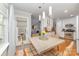 Well-lit dining area with pendant lighting, open layout, and seamless access to the kitchen at 10617 Fuller Ridge Cir, Charlotte, NC 28270
